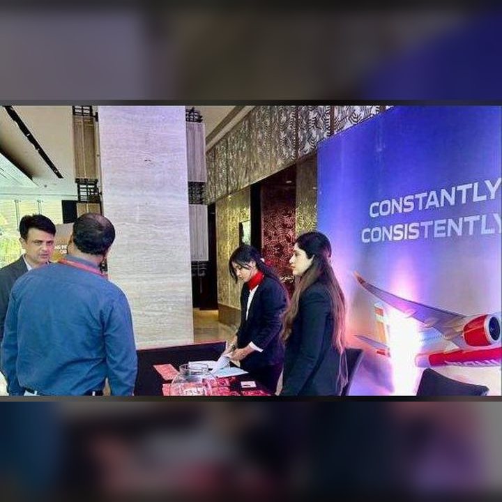 Conference desk team at an Air India event