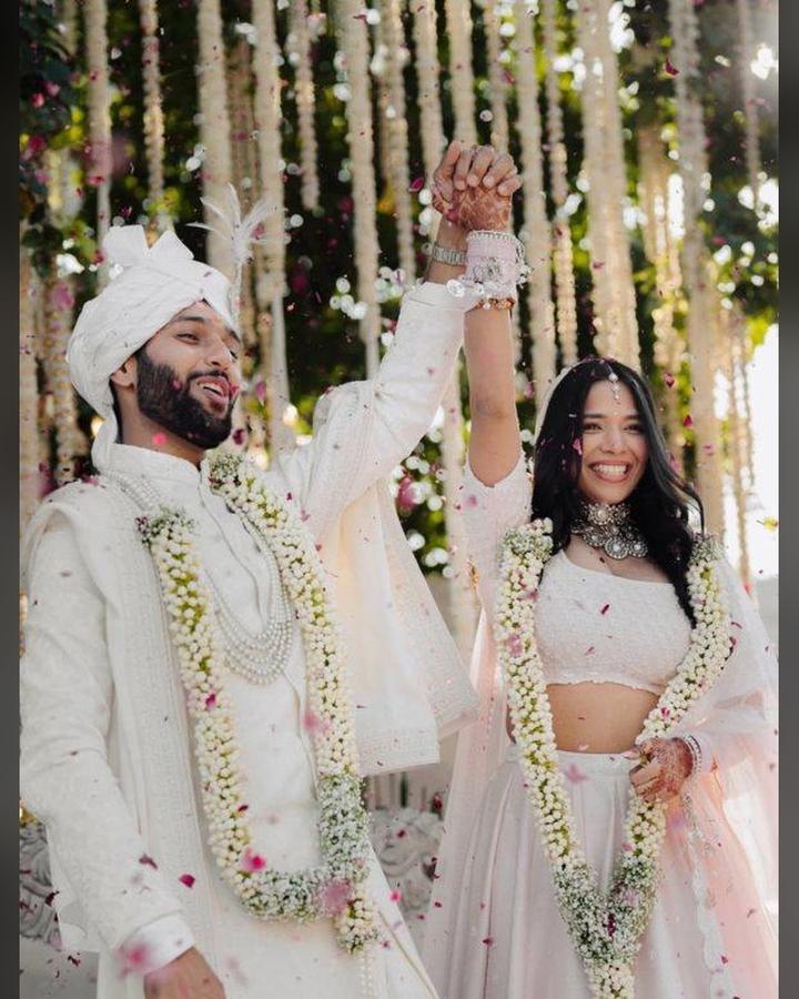 Couple celebrating at their wedding mandap