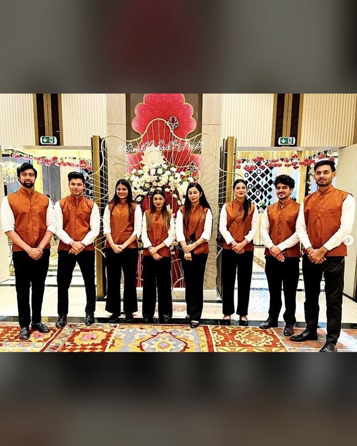 Uniformed wedding team ready to receive guests